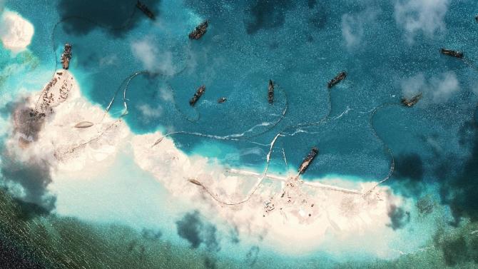 A satellite image of vessels purportedly dredging sand at Mischief Reef in the Spratly Islands in the disputed South China Sea taken by DigitalGlobe for the Asia Maritime Transparency Initiative on March 17, 2015