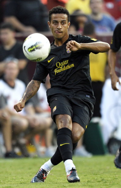 FC Barcelona's Thiago kicks the ball during the second half of their World Football Challenge 2011 soccer match against FC Barcelona, Saturday, July 30, 2011, in Landover, Md. Manchester United defeated FC Barcelona 2-1. (AP Photo/Cliff Owen)
