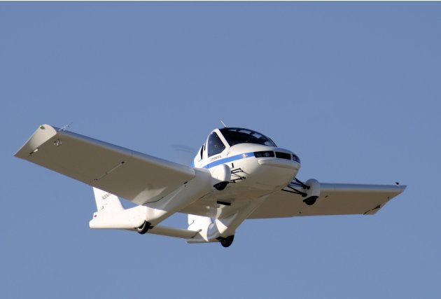 This March 23, 2012 photo provided by Terrafugia Inc. shows the company's prototype flying car, dubbed the Transition, during its first flight. The vehicle has two seats, four wheels and wings that fo