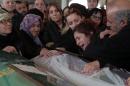 Hacer Parlak, mother of Destina Peri Parlak, 16, hugs the bridal veil-draped body of her daughter, one of the victims of Sunday's explosion, during the funeral procession in Ankara, Turkey, Tuesday, March 15, 2016. There was no immediate claim of responsibility for the Ankara attack, which authorities say was carried out by a female bomber and a possible male accomplice. Turkish Prime Minister Ahmet Davutoglu said there were "almost certain" indications that the attack was the work of the Kurdish rebel group, the PKK. (AP Photo/Burhan Ozbilici)