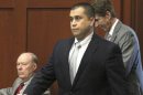 Zimmerman, the former neighborhood watch volunteer charged with second-degree murder for the shooting death of Trayvon Martin, walks into court with attorney O'Mara in Sanford