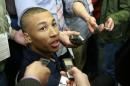 Dante Exum from Australia meets with reporters at the 2014 NBA basketball Draft Combine Thursday, May 15, 2014, in Chicago. Exum did not participate in his scheduled workout Thursday. (AP Photo/Charles Rex Arbogast)