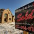 A sold sign is seen in fron of a new home in Jefferson, Pa., Wednesday, Jan. 18, 2012.   The economy likely grew at annual rate of 3 percent in the October-December quarter, according to a survey by FactSet.   (AP Photo/Gene J. Puskar)