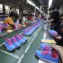 Chinese workers manufacture sports shoes at a shoe factory in Jinjiang in southeast China's Fujian province Friday Nov. 9, 2012. China's auto sales, consumer spending and factory output improved in October in a new sign of economic recovery as the Communist Party prepared to install a new generation of leaders. Growth in factory output accelerated to 9.6 percent over a year earlier from the previous month's 9.2 percent, the government reported Friday. (AP Photo) CHINA OUT