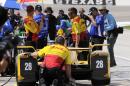 Crew members for Ryan Hunter-Reay (28) prepare for a morning IndyCar auto race practice at Texas Motor Speedway in Fort Worth, Texas, Friday June, 5, 2015. Hunter-Reay crashed during the session for Saturday night's race. (AP Photo/Ralph Lauer)