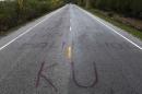 Separatist graffiti is seen on a road near Pattani, one of three southernmost provinces of Thailand where government troops have fought Muslim insurgents since 2004