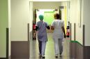 Nurses walk in a corridor on September 20, 2013 in a hospital in France