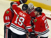 Chicago Blackhawks' Marian Hossa (81), Jonathan Toews (19) and Duncan Keith (2) congratulate goalie Ray Emery after they defeated the Los Angles Kings 3-2 on Sunday, Feb. 17, 2013, in Chicago. (AP Photo/John Smierciak)