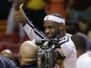 Miami Heat's LeBron James celebrates after the Heat defeated the Charlotte Bobcats during a NBA basketball game in Miami, Sunday, March 24, 2013. The Heat won 109-77 for their 26th victory in a row.  (AP Photo/J Pat Carter)