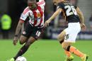 Sunderland's English striker Jermain Defoe (L) vies with Exeter City's English defender Jordan Tillson during the English League Cup second round football match in Sunderland, north east England on August 25, 2015
