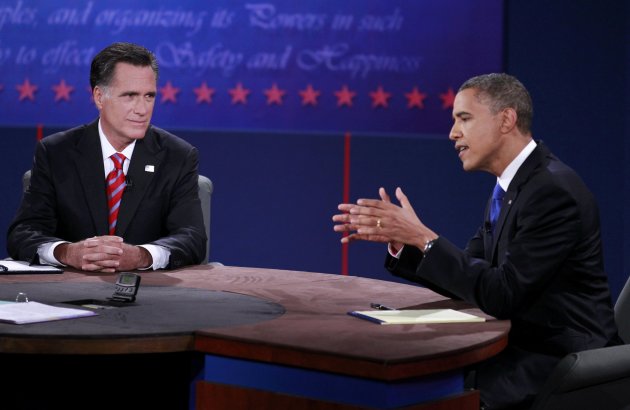 U.S. Republican presidential nominee Mitt Romney (L) listens as U.S. President Barack Obama answers a question during the final U.S. presidential debate in Boca Raton, Florida, October 22, 2012. REUTERS/Joe Skipper (UNITED STATES  - Tags: POLITICS ELECTIONS USA PRESIDENTIAL ELECTION)