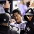 Colorado Rockies' Jhoulys Chacin is congratulated after scoring on an RBI-single by Mark Ellis during the third inning of a baseball game against the San Francisco Giants Thursday, Sept. 15, 2011, in Denver. (AP Photo/Jack Dempsey)
