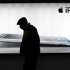 FILE - In this Tuesday, Feb. 28, 2012 file photo, a man walks past an advertisement of Apple's iPad 2 in Shanghai, China. Chinese media reports said Monday, March 5, 2012, a major creditor of Proview Electronics, which is challenging Apple Inc.'s use of the iPad trademark, has moved to have the ailing computer monitor maker liquidated. Reports by the Xinhua News Agency and other mainland media said Taiwan-based Fubon Insurance is seeking $8.68 million in debts. (AP Photo/Eugene Hoshiko, File)