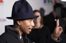 Singer Pharrell Williams gestures as he attends MOCA's 35th Anniversary Gala at MOCA in Los Angeles