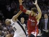 San Antonio Spurs' Tony Parker (9), of France, is fouled by  Los Angeles Clippers' Blake Griffin (32) while moving the ball upcourt during the second quarter of Game 2 of an NBA basketball Western Conference semifinal playoff series on Thursday, May 17, 2012, in San Antonio. (AP Photo/Eric Gay)