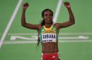 Ethiopia's Genzebe Dibaba celebrates after the 3000 meters final at the IAAF World Indoor athletic championships in Portland, Oregon on March 20, 2016