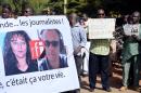 Malian journalists hold banners during a march on November 4, 2013 in Bamako