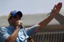 Venezuelan opposition candidate Henrique Capriles talks to supporters during an election rally in the state of Carabobo