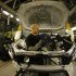 Staff work on the Jaguar XJ production line at their Castle Bromwich Assembly Plant in Birmingham