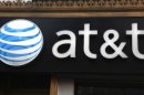 FILE-This May 6, 2012, file photo, shows an AT&T sign at a store in New York. AT&T is seeing declining smartphone sales, leading to the best profitability ever in its wireless arm as it saves on phone subsidies. The largest telecommunications company in the U.S. says it activated 5.1 million smartphones in its latest quarter, down from 5.5 million in the same period a year ago. (AP Photo/CX Matiash, File)