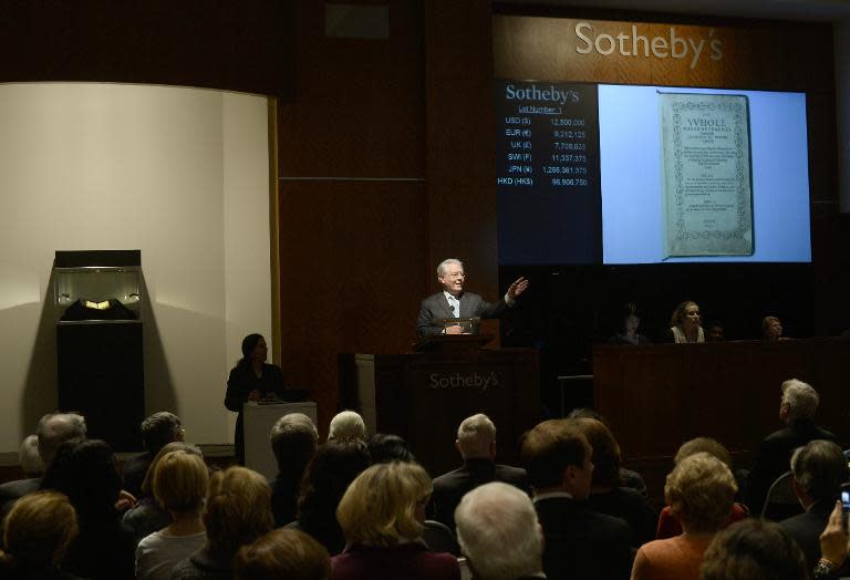 Auctioneer David Redden is pictured during the sale of the translation of Biblical psalms, "The Bay Psalm Book", at Sotheby's in New York November 26, 2013