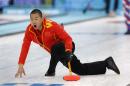 China's skip Liu Rui shouts to his weepers after delivering the rock during men's curling competition against Norway at the 2014 Winter Olympics, Friday, Feb. 14, 2014, in Sochi, Russia. (AP Photo/Robert F. Bukaty)