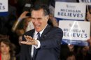 U.S. Republican presidential candidate and former Massachusetts Governor Mitt Romney arrives to address supporters at his Michigan primary night rally in Novi
