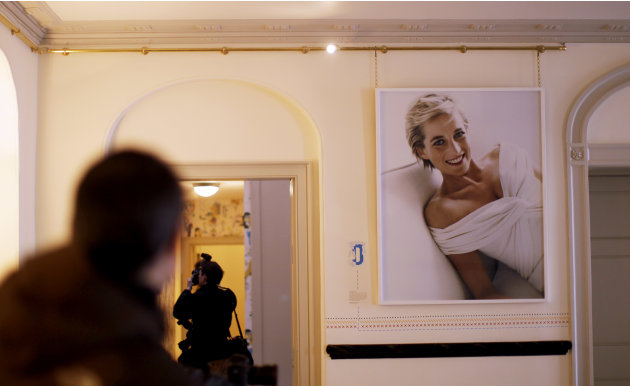 A photograph of the late Princess Diana taken by Mario Testino in 1997 is displayed as members of the media work during a press preview at what used to be her official residence, Kensington Palace in 