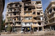 Destruction is pictured in Aleppo's Suleiman al-Halabi nieghbourhood, now under full army control according to state media. A Syrian fighter jet hit targets inside Damascus for the first time on Tuesday, a watchdog said, as air strikes pounded rebel bastions around the country and an air force general was shot dead