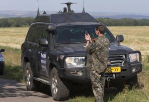 A pro-Russian rebel takes photos of cars of the convoy &hellip;