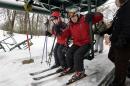 Skiers get on a chairlift at Blue Hills Ski Area Sunday, Dec. 15, 2013 in Canton, Mass. The National Weather Service says parts of Massachusetts, Connecticut and Rhode Island will see snow accumulation of between 6 inches and a foot. (AP Photo/Steven Senne)