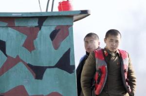 North Korean soldiers look out from a patrol boat on&nbsp;&hellip;