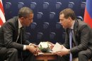 FILE - In this March 26, 2012 file photo, President Barack Obama talks with Russian President Dmitry Medvedev in Seoul, South Korea. After a week like this, is it any wonder voters are cynical? Within five days of each other, both the president and the campaign of his leading Republican opponent have had to deal with their own 