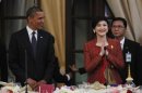 U.S. President Obama watches on as Thailand's Prime Minister Shinawatra arrives at a dinner at Government House in Bangkok