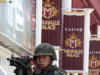 A soldier holds a machine gun outside a casino in Monterrey, Mexico, Saturday, Aug. 27, 2011. According to an official of Mexico's Attorney General's Office  soldiers and federal agents have confiscated hundreds of slot machines at five casinos in Monterrey. A surveillance tape showed eight or nine men arriving in four cars Thursday at the Casino Royale in Monterrey and setting fire to the building, trapping dozens of people inside and killing at least 52 people. (AP Photo/Arnulfo Franco)