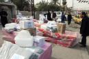 Displaced Iraqi Sunnis fleeing from Islamic State militants in al-Baghdadi district in Anbar provinces, receive aid from the United Nations Refugee Agency (UNHCR) in Baghdad