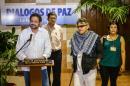 FARC-EP Commander Ivan Marquez (L) gives a speech next to Commander Pablo Catatumbo (2-L), Commander Jesus Santrich (2-R) and guerrilla member Maritza Garcia in Havana on November 28, 2013, during the restart of Peace-Talks with Colombian government