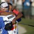 Tiger Woods, rear, embraces his caddie Joe LaCava after winning the Arnold Palmer Invitational golf tournament at Bay Hill in Orlando, Fla., Sunday, March 25, 2012.(AP Photo/Phelan M. Ebenhack)