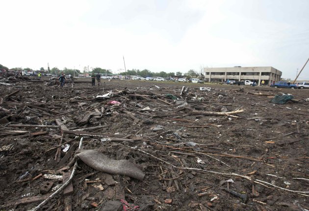 Parts of trees and household debris cover the ground after a huge tornado struck Moore, Oklahoma