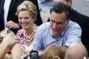 Republican presidential candidate and former Massachusetts Gov. Mitt Romney and wife Ann campaign at Tradition Town Square in Port St. Lucie, Fla., Sunday, Oct. 7, 2012. (AP Photo/Charles Dharapak)