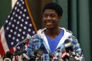 Kwasi Enin, a high school senior, smiles after announcing he will attend Yale University during a press conference at William Floyd High School in Mastic Beach, New York