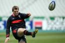 Wales' Mike Phillips kicks the ball during a training session on February 8, 2013 at the Stade de France in Saint-Denis