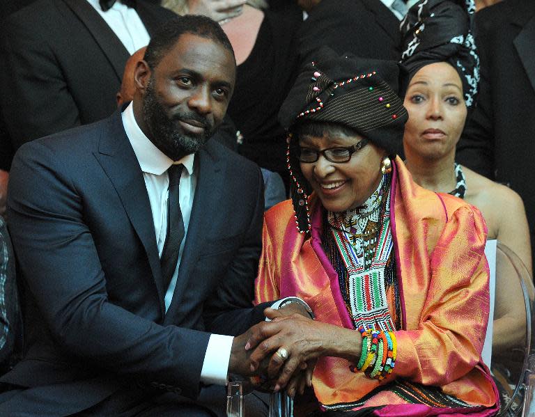 Nelson Mandela's second wife Winnie Madikizela–Mandela (R) and British actor Idris Elba, who plays the role of Nelson Mandela in the movie "Mandela, Long Walk to Freedom", attend the movie's premiere in Johannesburg on November 3, 2013