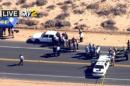 This video image provided by KCBS-TV shows the site of s shooting Friday Oct. 25, 2013 ion Ridgecrest, Calif. A homicide suspect was killed by police on this Mojave Desert highway early Friday after a lengthy pursuit in which the man fired at vehicles and two hostages in his car trunk, authorities said.(AP Photo/KCBS-TV)