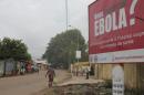 A billboard with a message about Ebola is seen on a street in Conakry, Guinea