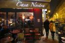 People pass by the "Casa Nostra" restaurant in Paris on February 5, 2016