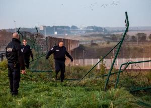 Security agents stand in front of a damaged fence after&nbsp;&hellip;