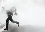 A Malaysian activist from Coalition for Clean and Fair Elections (Bersih) is sprayed by water cannon during a rally in Kuala Lumpur, Malaysia, Saturday, July 9, 2011. Police fired tear gas and detained hundreds of activists as more than 10,000 demonstrators massed across Malaysia's largest city demanding electoral reforms in the country's biggest political rally in years. (AP Photo/Lai Seng Sin)