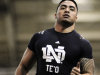 FILE - In this March 26, 2013, file photo, linebacker Manti Te'o eases up after running the 40-yard dash during Notre Dame's pro day for NFL football scouts in South Bend, Ind. Combine the good, bad and bizarre, and when Te'o gets selected might be the most intriguing part of the NFL draft that starts Thursday, March 25, in New York. (AP Photo/Joe Raymond)