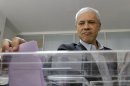 Democratic Party leader and former president Boris Tadic casts his ballot at a polling station in downtown Belgrade, Serbia, Sunday, May 6, 2012. Serbia, a landlocked nation of 7.1 million people in southeast Europe, is holding presidential, parliamentary and municipal elections Sunday. Whoever wins could affect Serbia's future relations with the European Union as well as Kosovo, a one-time province whose declaration of independence Serbia has refused to accept.(AP Photo/Darko Vojinovic)